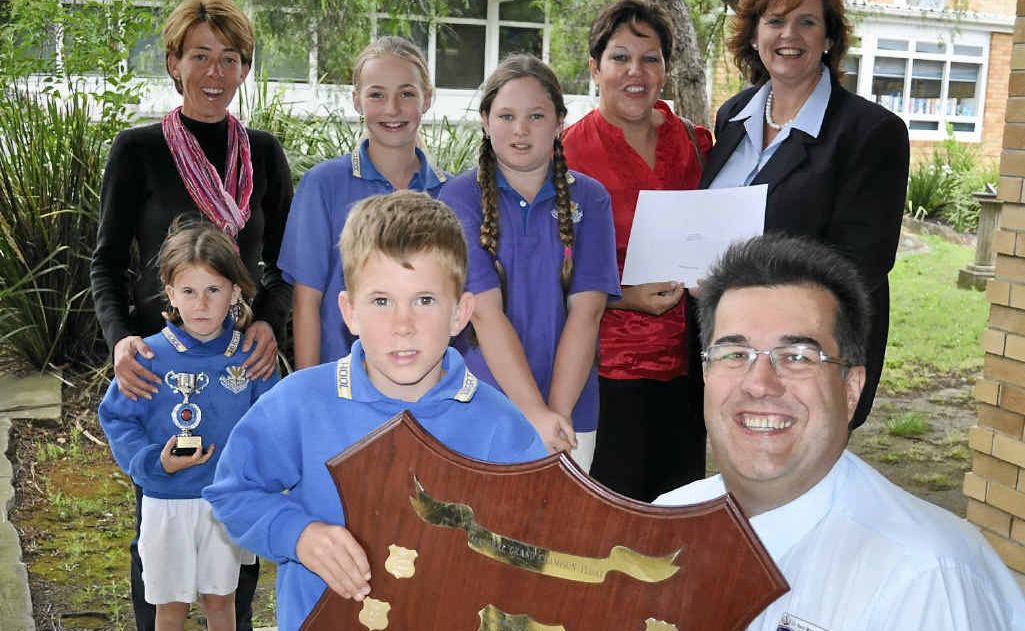Southern Downs Regional Councillor Neil Meiklejohn (front right) with Warwick Tourism CEO Tracy Vellacott (back right) hands the award to (front) Harry McMahon, (back) Leonie McMahon, Caity McMahon, Lily Maw, Grace Blake and Valerie White. Southern Downs Regional Councillor Neil Meiklejohn (front right) with Warwick Tourism CEO Tracy Vellacott (back right) hands the award to (front) Harry McMahon, (back) Leonie McMahon, Caity McMahon, Lily Maw, Grace Blake and Valerie White.